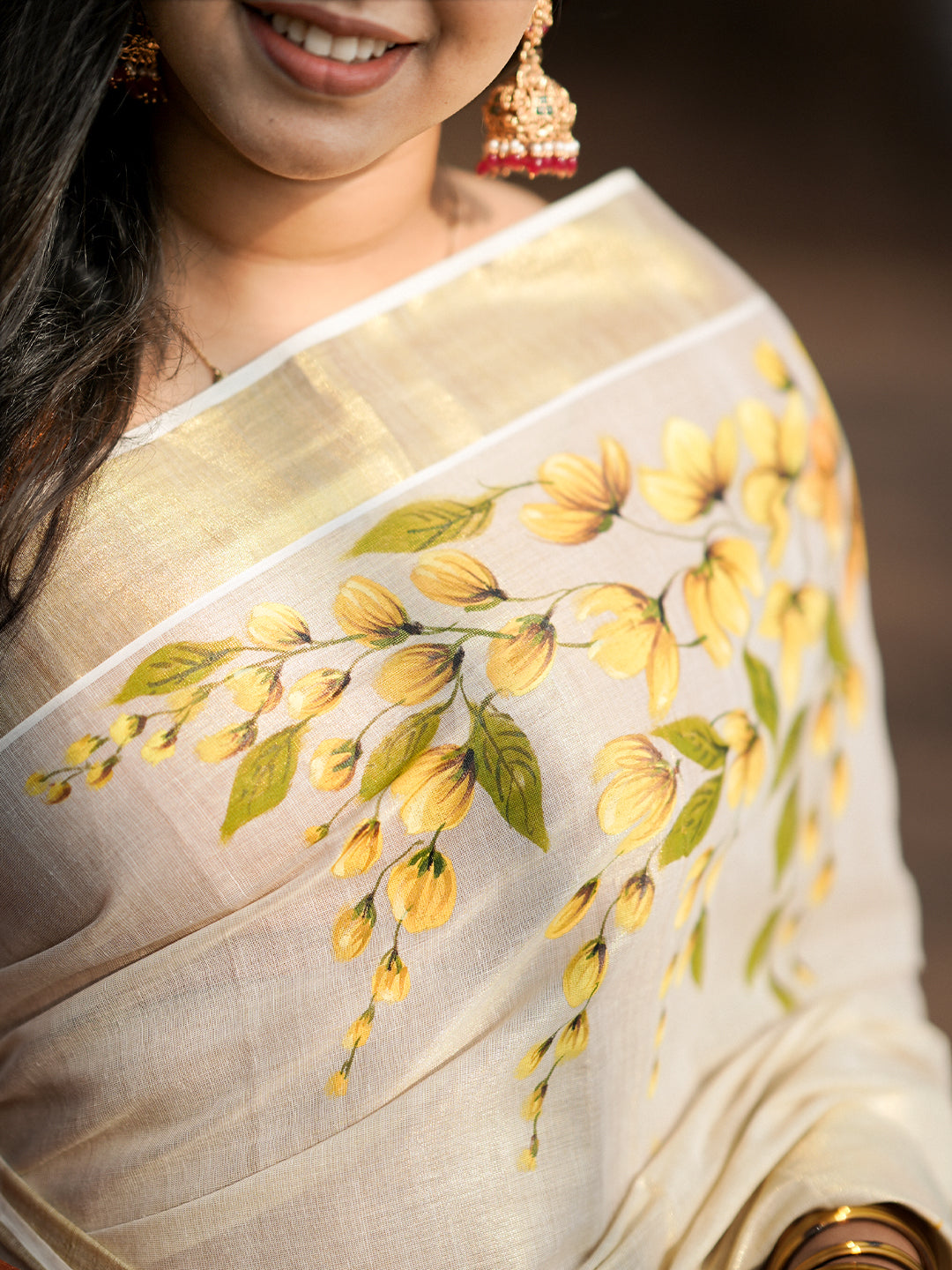 Vishu Kani motif hand painted Kerala saree – close-up of traditional design